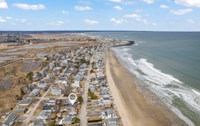 bird's eye view featuring a beach view and a water view