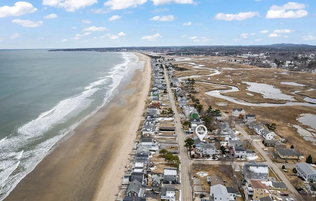 aerial view with a water view and a beach view