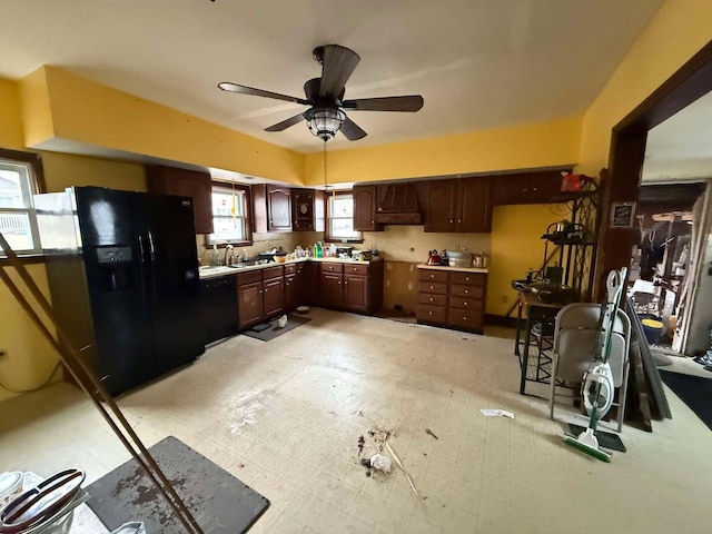 kitchen featuring black appliances, ceiling fan, a healthy amount of sunlight, and dark brown cabinetry