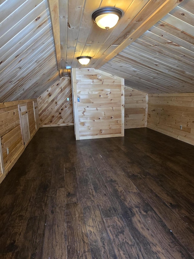 additional living space with dark wood finished floors, lofted ceiling, wooden walls, and wood ceiling