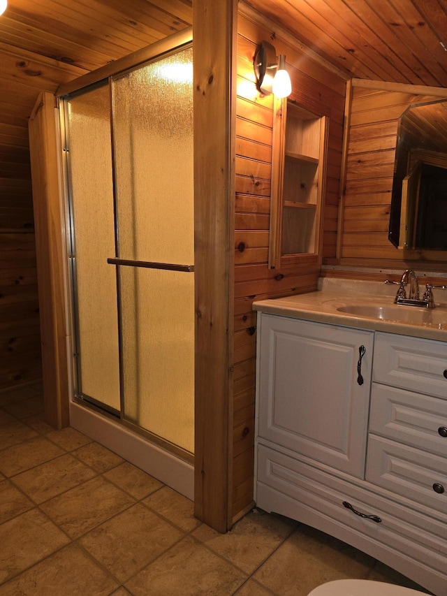 bathroom featuring vanity, a shower stall, wood ceiling, and wood walls