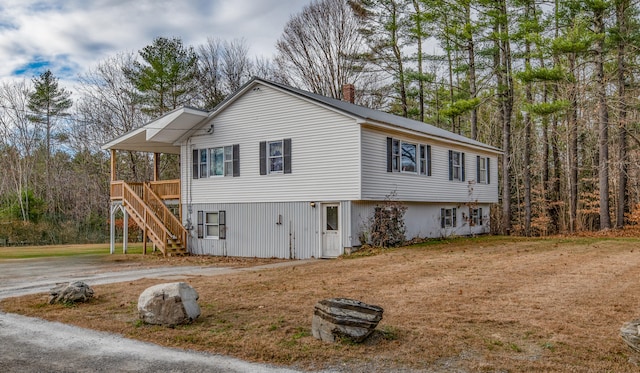 view of property exterior featuring a wooden deck