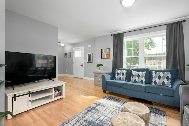 living room with light hardwood / wood-style floors