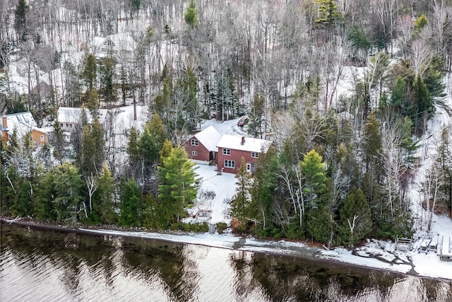 snowy aerial view featuring a water view