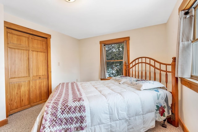 carpeted bedroom featuring a closet