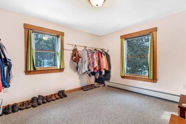 walk in closet featuring a baseboard heating unit