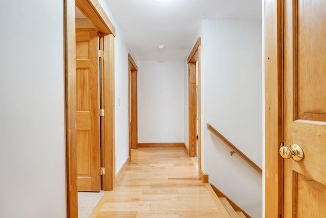 hallway with light wood-type flooring