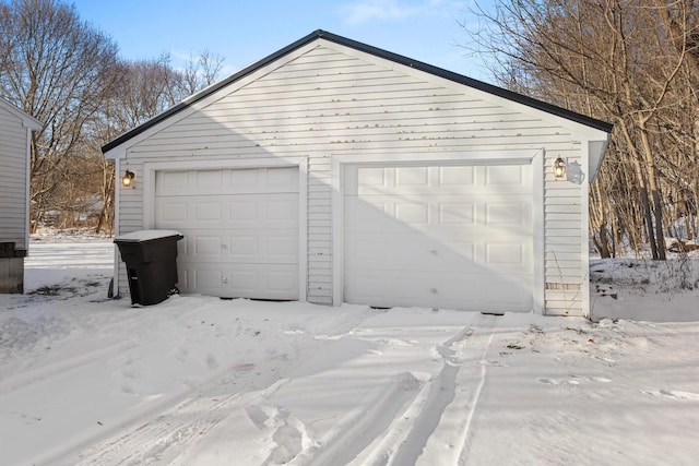 view of snow covered garage