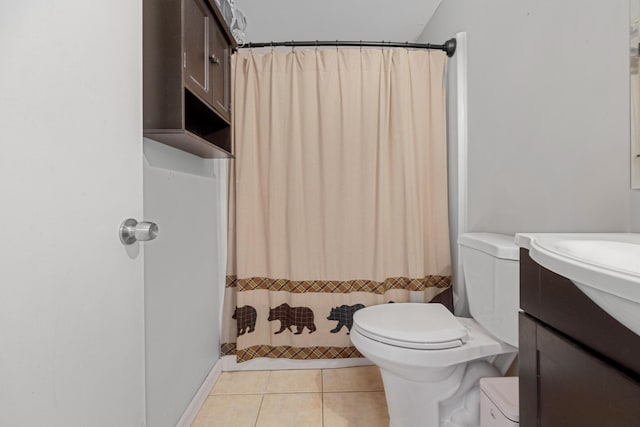 bathroom featuring toilet, tile patterned flooring, and curtained shower