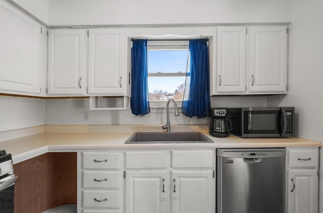 kitchen with sink, white cabinets, and dishwasher