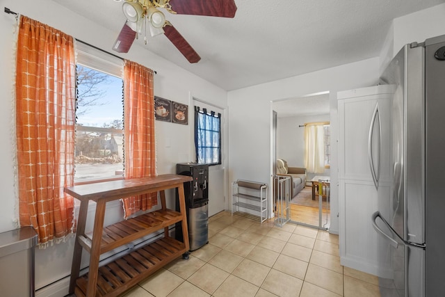 dining room featuring light tile patterned flooring and ceiling fan