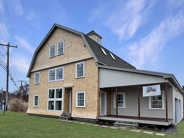7 Justin Cir, York, ME 03909 - rear view of property with covered porch, a lawn, and a gambrel roof