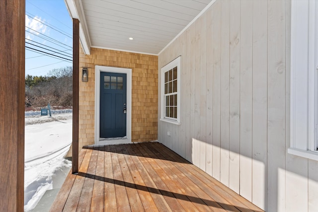 view of snow covered property entrance