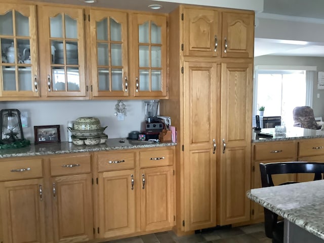 kitchen featuring light stone counters