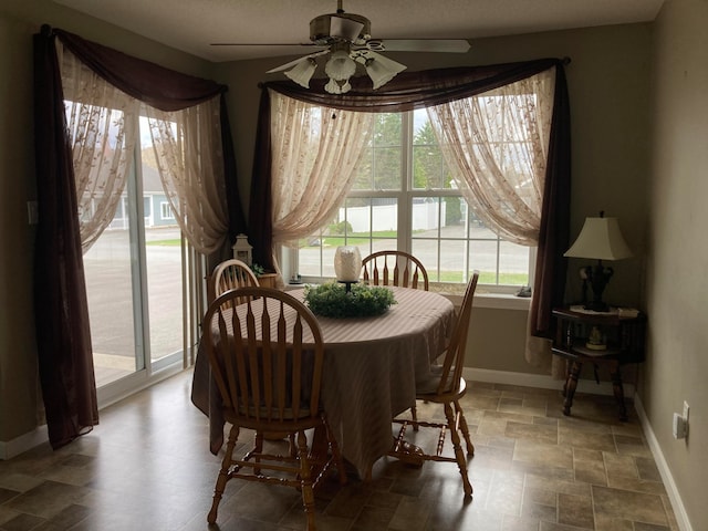 dining area featuring ceiling fan and a healthy amount of sunlight