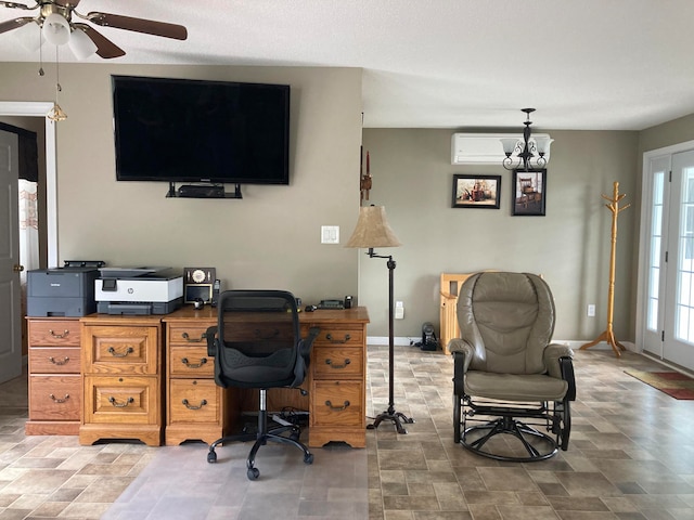 office space with ceiling fan with notable chandelier and an AC wall unit