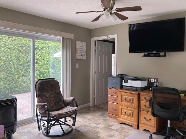 office featuring a textured ceiling and ceiling fan