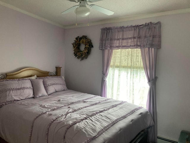 bedroom featuring ceiling fan, ornamental molding, a textured ceiling, and a baseboard radiator