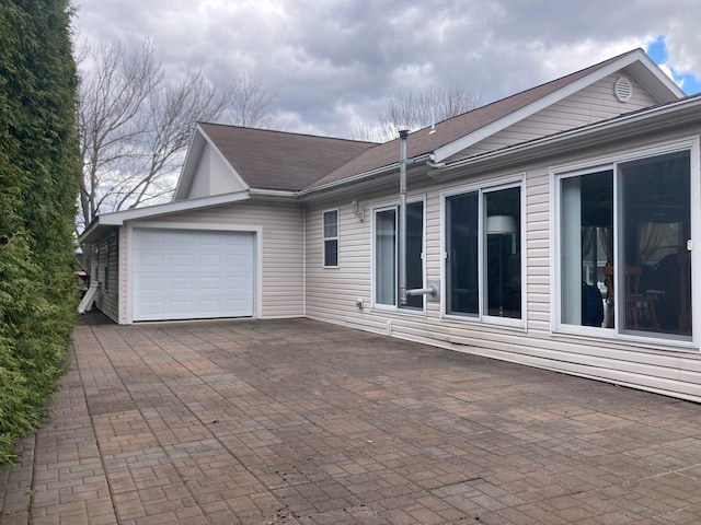 view of side of home featuring a garage