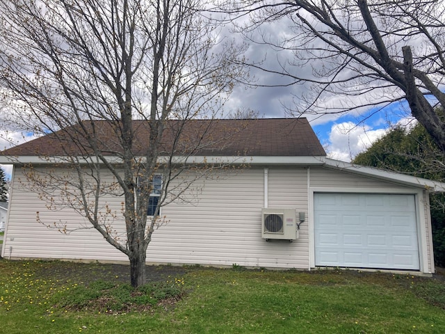 view of home's exterior featuring ac unit, a yard, and a garage