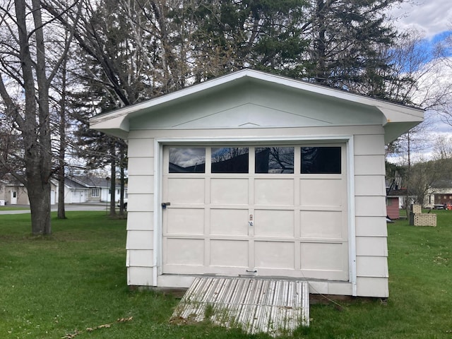 garage with a yard