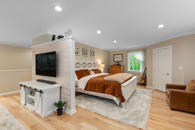 bedroom featuring light hardwood / wood-style flooring and ornamental molding