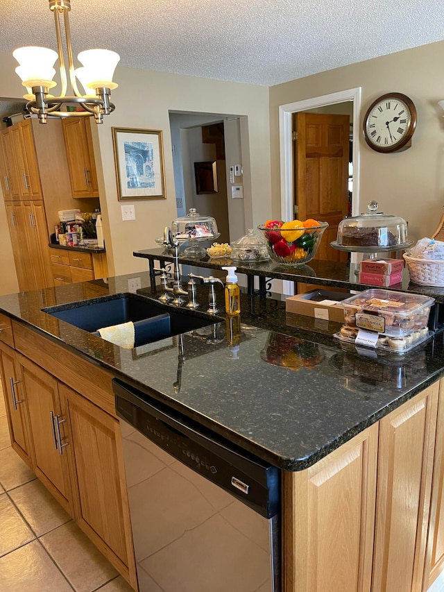 kitchen featuring a textured ceiling, dishwasher, hanging light fixtures, and a chandelier