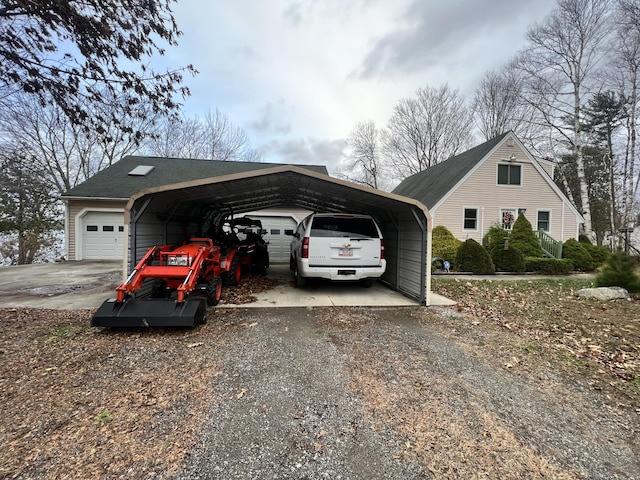 45 Douglas Dr, Newport, ME 04953 - view of property exterior with a garage, a carport, and gravel driveway