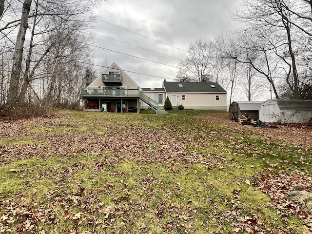 45 Douglas Dr, Newport, ME 04953 - rear view of house with a storage shed, a wooden deck, and stairway