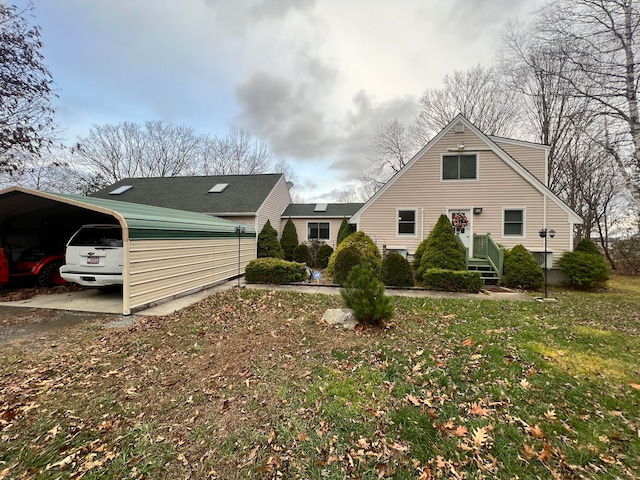 view of property exterior with a yard and a carport