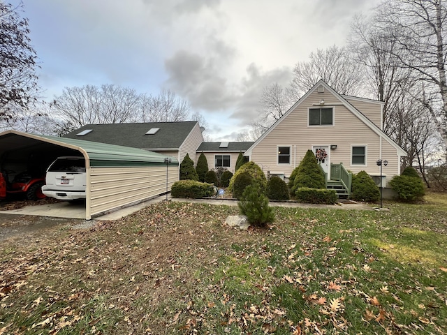 45 Douglas Dr, Newport, ME 04953 - back of house with a carport and a lawn