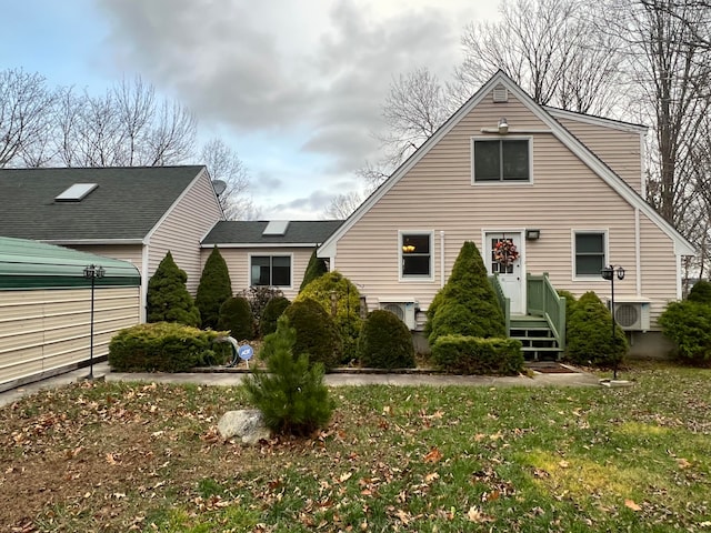 view of home's exterior featuring a lawn and ac unit