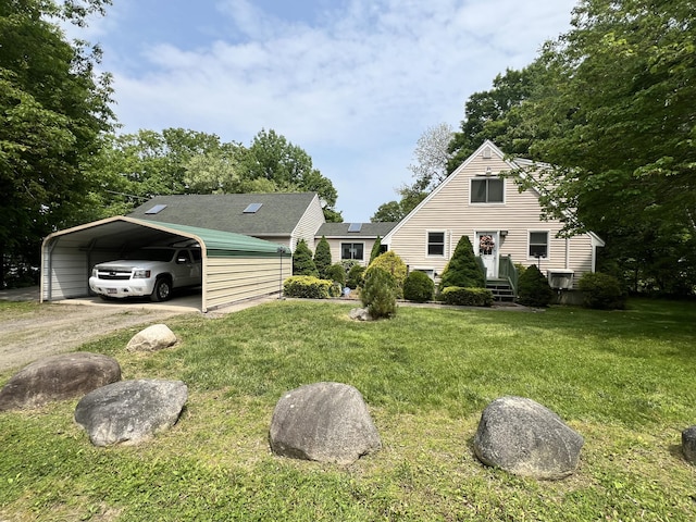 45 Douglas Dr, Newport, ME 04953 - view of front of property with a front yard, a carport, and driveway