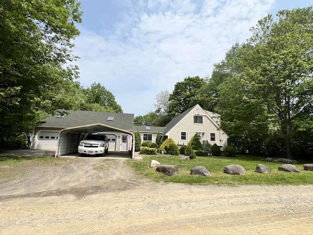 45 Douglas Dr, Newport, ME 04953 - view of front of property with dirt driveway, a detached carport, and a front yard