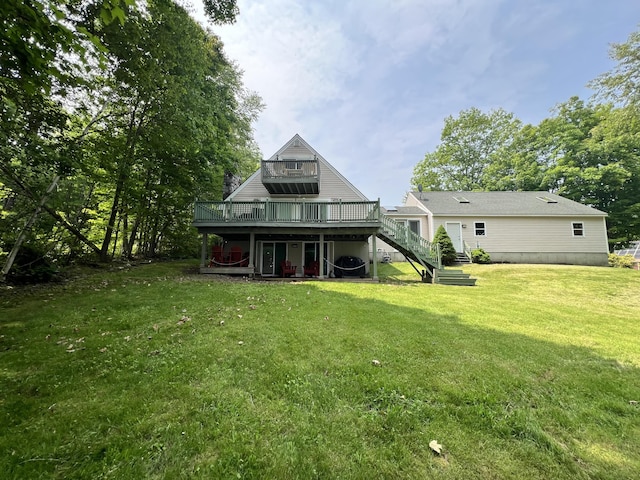 45 Douglas Dr, Newport, ME 04953 - rear view of house with a deck, stairway, and a lawn