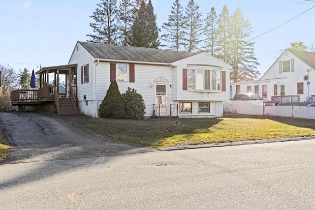 raised ranch with a front lawn