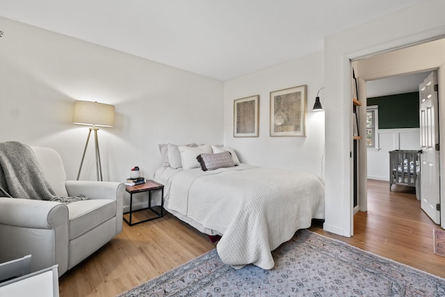 bedroom with light wood-type flooring