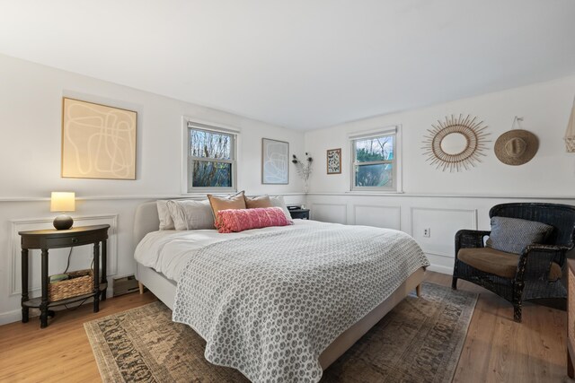 bedroom with light hardwood / wood-style flooring