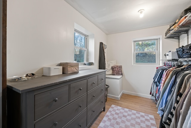 spacious closet with light hardwood / wood-style floors