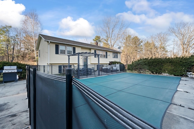 exterior space featuring a pergola and grilling area