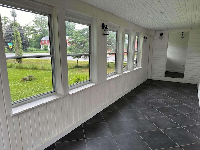 unfurnished sunroom featuring plenty of natural light