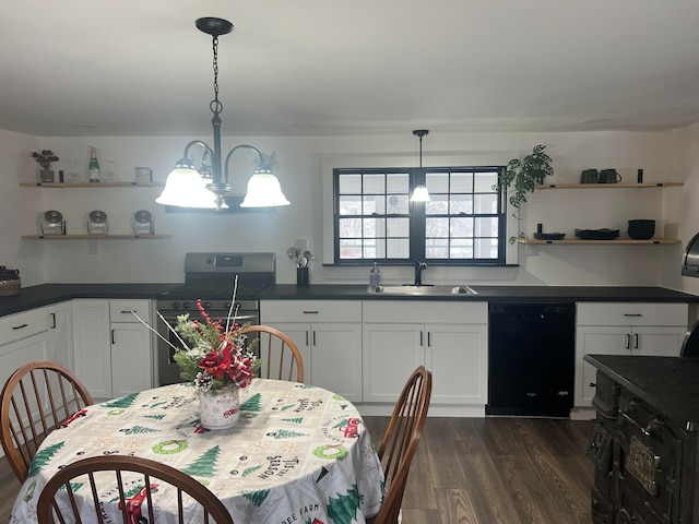 kitchen with sink, dark wood-type flooring, an inviting chandelier, decorative light fixtures, and black appliances