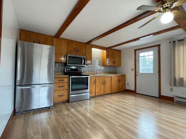 kitchen featuring tasteful backsplash, beamed ceiling, light wood-type flooring, and appliances with stainless steel finishes