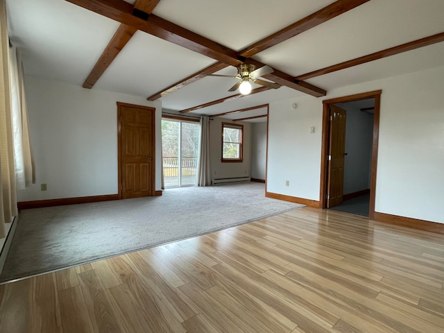 empty room with beam ceiling, light wood-type flooring, baseboard heating, and ceiling fan