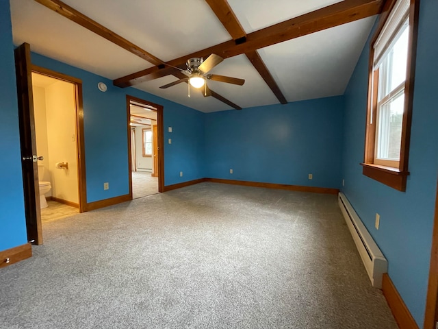 unfurnished bedroom with carpet, ensuite bathroom, ceiling fan, a baseboard heating unit, and vaulted ceiling with beams