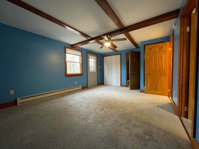 unfurnished bedroom featuring carpet, two closets, baseboard heating, ceiling fan, and beamed ceiling