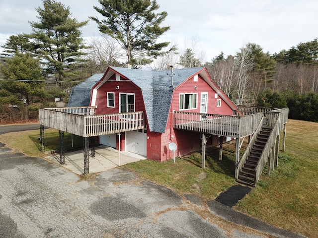 view of front of property featuring a wooden deck and a garage