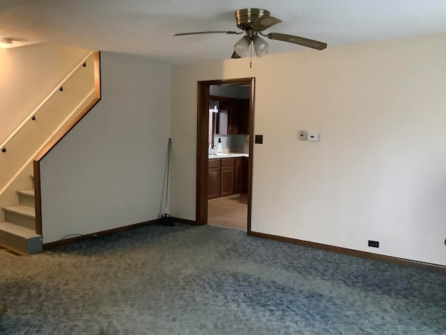 carpeted empty room with ceiling fan