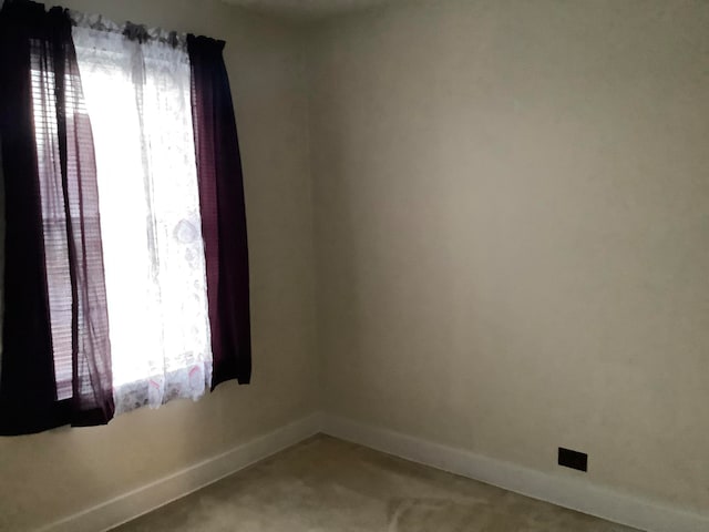 view of carpeted spare room