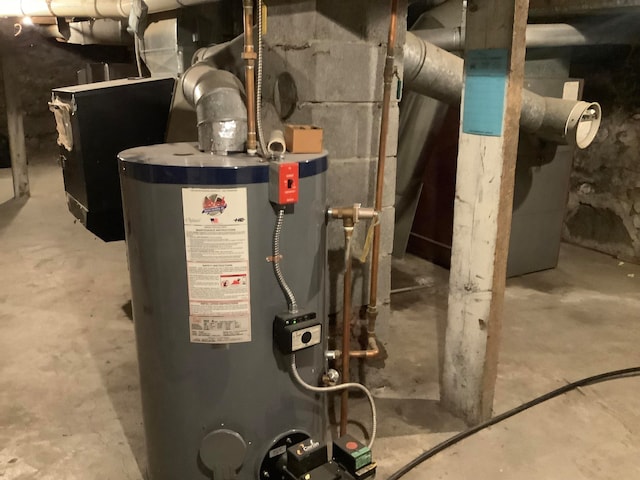 utility room with water heater